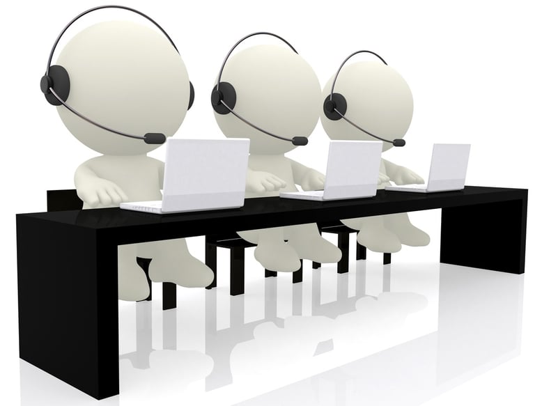 Call center operators sitting at their desks - isolated over a white background.jpeg